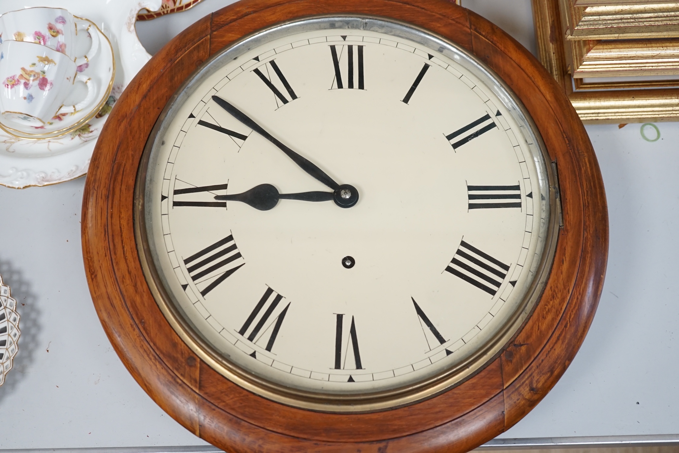 A Victorian mahogany circular dial eight day wall timepiece, with a spring driven movement and a white enamelled dial with Roman numerals, diameter 40cm